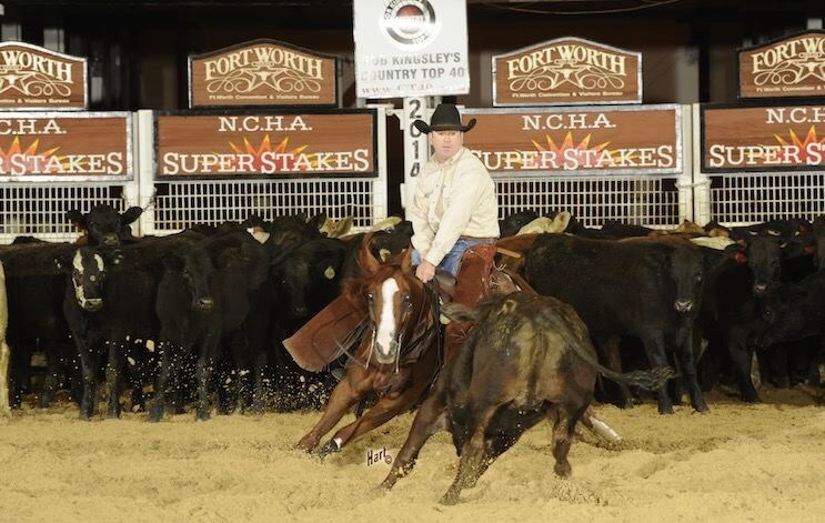 John Mitchell riding a brown horse for the NCHA Super Stakes