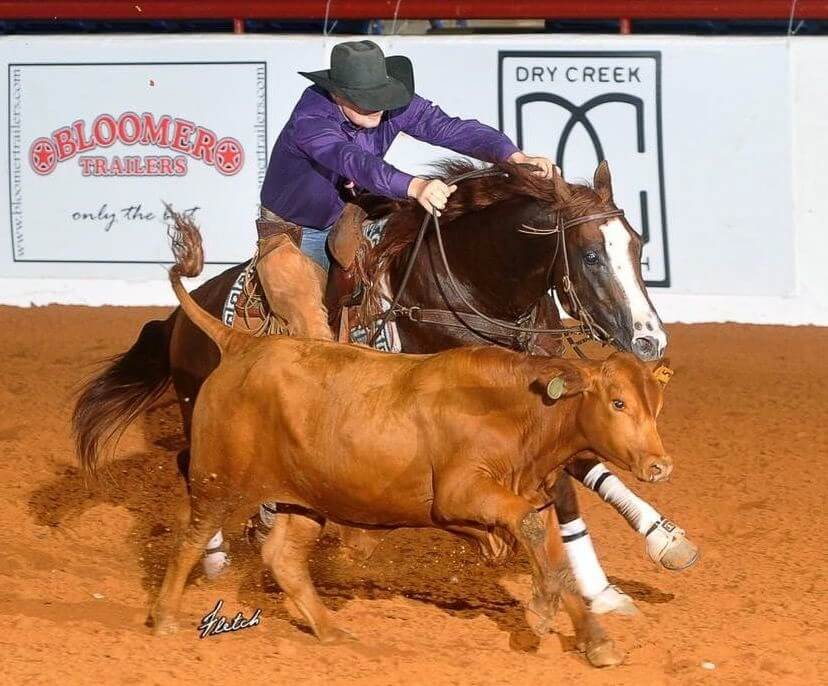 Clay Volmer riding a horse in a competition