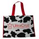 The UltraCruz® Cow Print Bag features a bold black and white cow print design with a red logo and handles, providing a sty